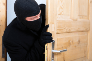 Burglar attempting to sneak into someone's house